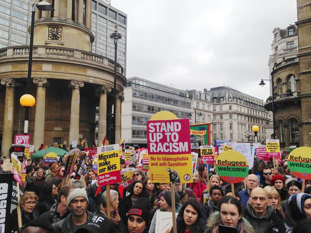 Protesters arrived at Portland Place in Central London at around midday holding banners adorning defiant messages of solidarity