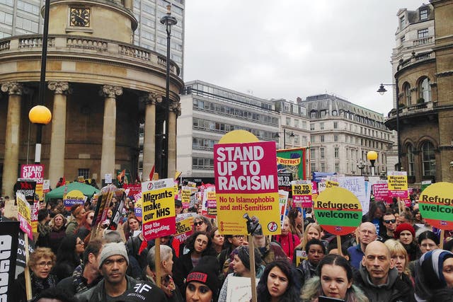 Thousands of protesters arrived at Portland Place in Central London at around midday holding banners adorning defiant messages of solidarity