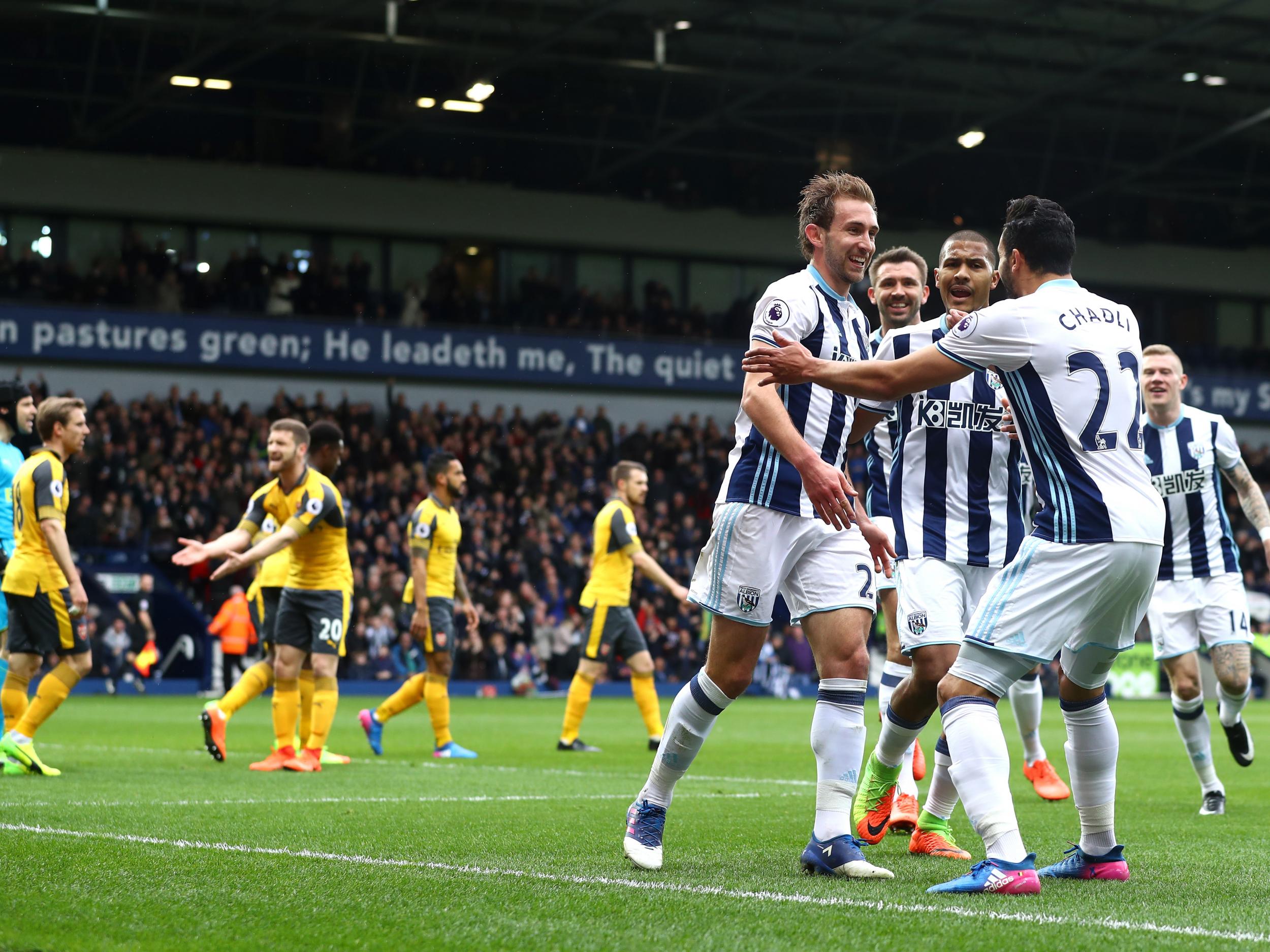 Craig Dawson is mobbed after scoring his second for West Brom