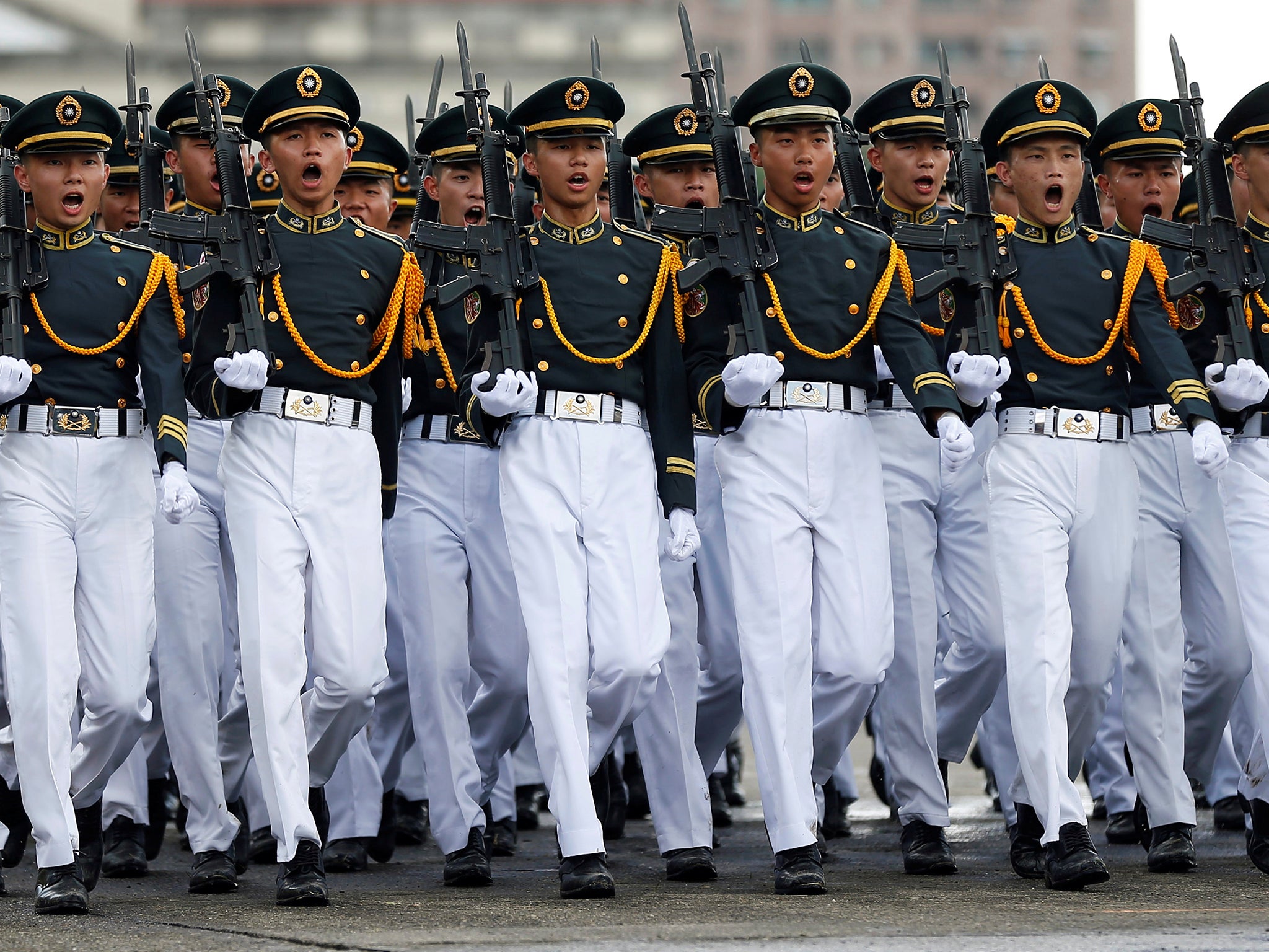 Taiwanese cadets march during a ceremony to mark the 92nd anniversary of the Whampoa Military Academy, in Kaohsiung, southern Taiwan