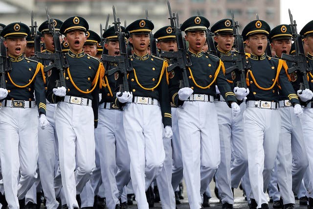 Taiwanese cadets march during a ceremony to mark the 92nd anniversary of the Whampoa Military Academy, in Kaohsiung, southern Taiwan