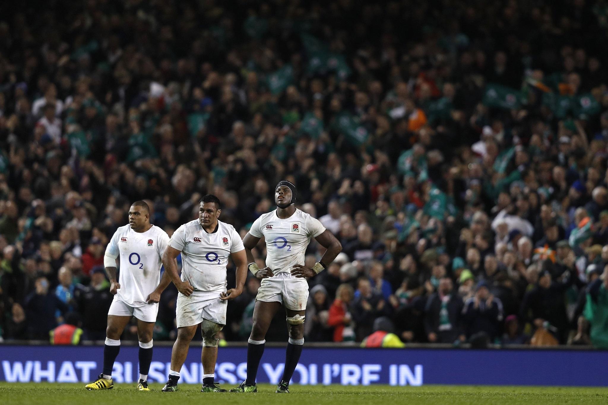 Kyle Sinckler, Mako Vunipola and Maro Itoje look on dejected after defeat by Ireland