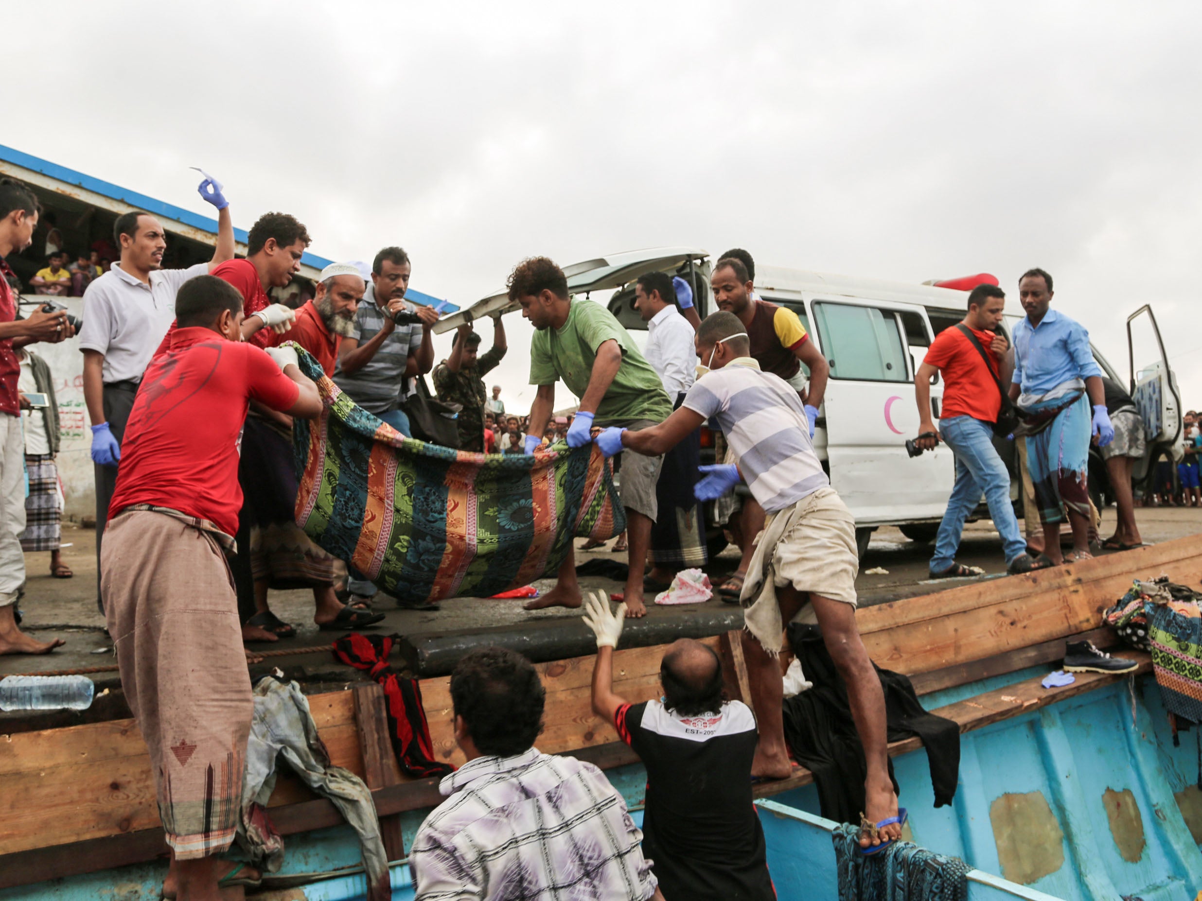 Bodies of people who were killed in a boat carrying Somali refugees arriving in the rebel-held Yemeni port city of Hodeida