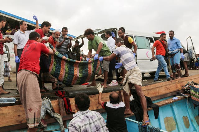 Bodies of people who were killed in a boat carrying Somali refugees arriving in the rebel-held Yemeni port city of Hodeida