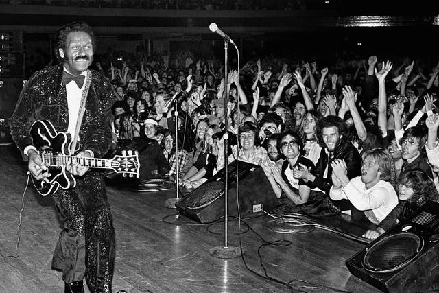 Rock'n'roll legend Chuck Berry struts his signature 'duck walk'