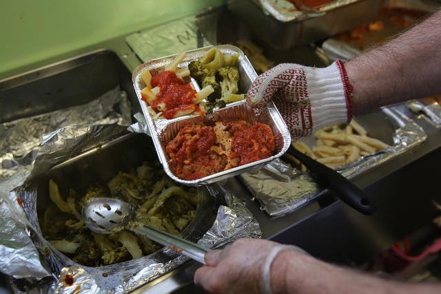 A Catholic Services worker prepares Meals on Wheels lunch delivery on March 12, 2014 in Franklin, New Jersey.