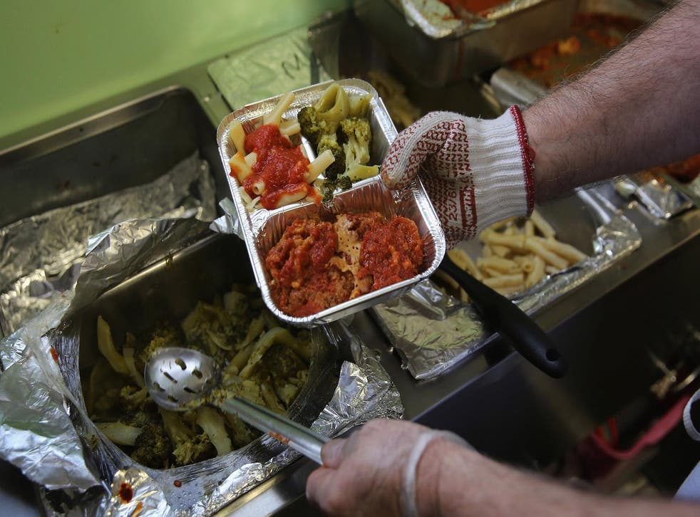A Catholic Services worker prepares Meals on Wheels lunch delivery on March 12, 2014 in Franklin, New Jersey.