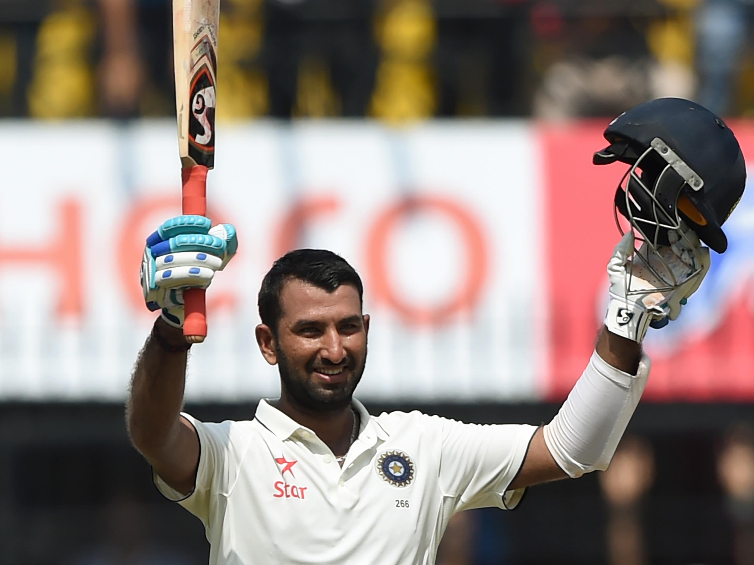 Pujara celebrates his historic innings