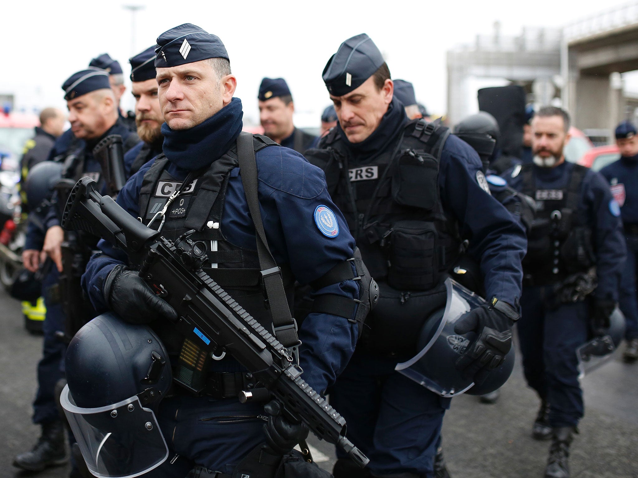 French police secure the area at Paris Orly airport in the aftermath of the shooting