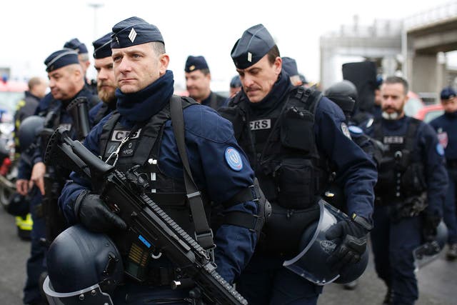 French police secure the area at Paris Orly airport in the aftermath of the shooting