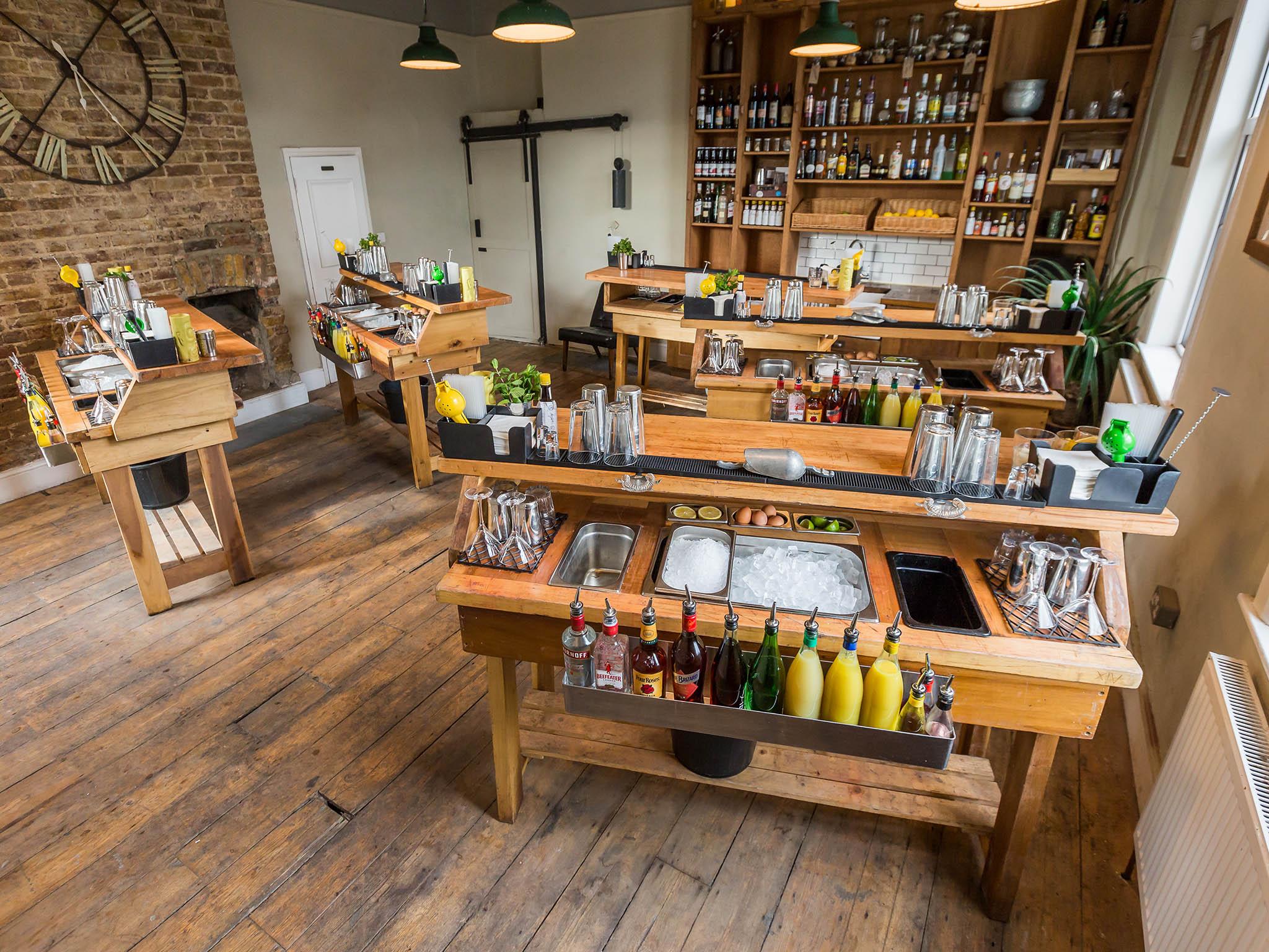 Students work from their own custom-built cocktail station at TT Liquor