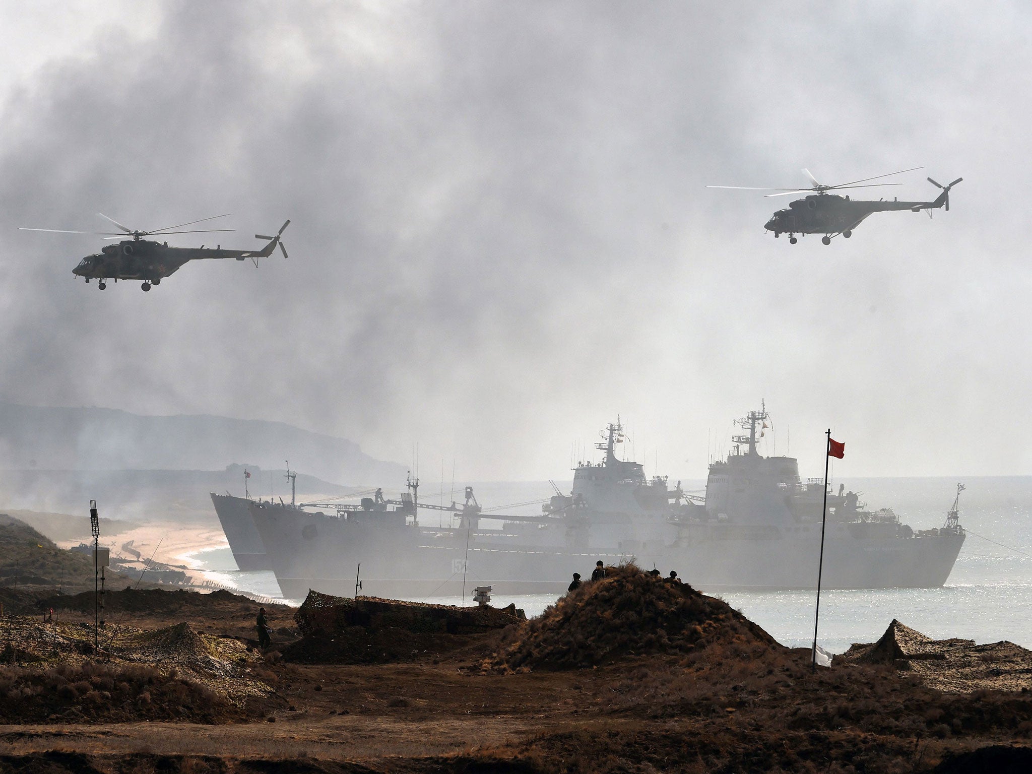 Russia's navy ships and helicopters take part in a military exercise off the coast of the Black Sea in Crimea in September 2016