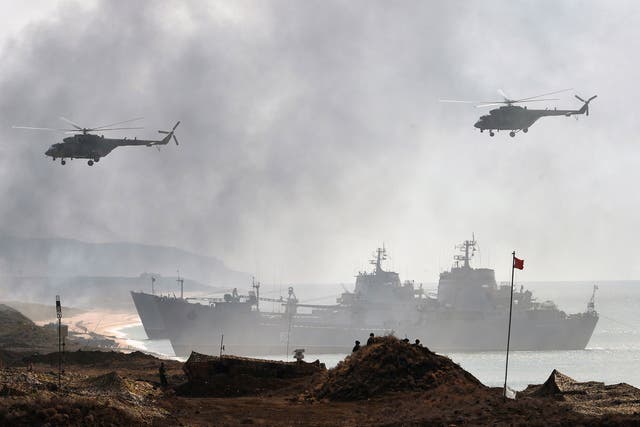 Russia's navy ships and helicopters take part in a military exercise off the coast of the Black Sea in Crimea in September 2016
