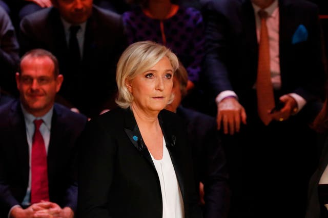 Le Pen and Macron clash over immigration and burkini policy