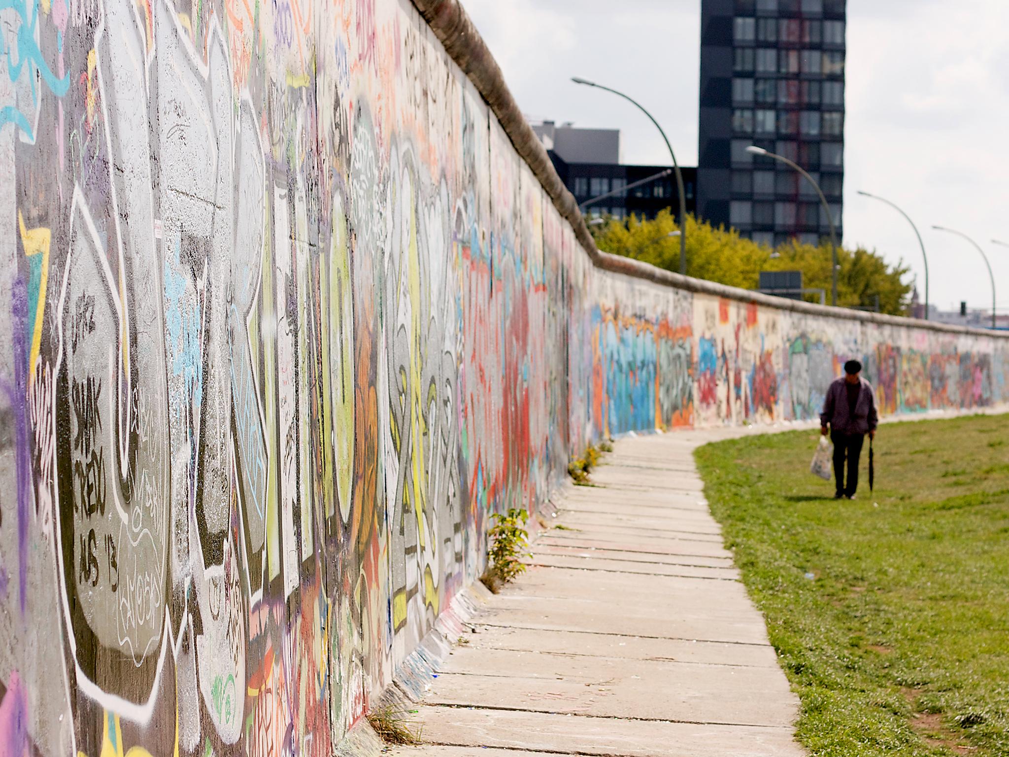 Some of the Berlin Wall still stands as a reminder to future generations (Fabiano Rebeque/Flickr)
