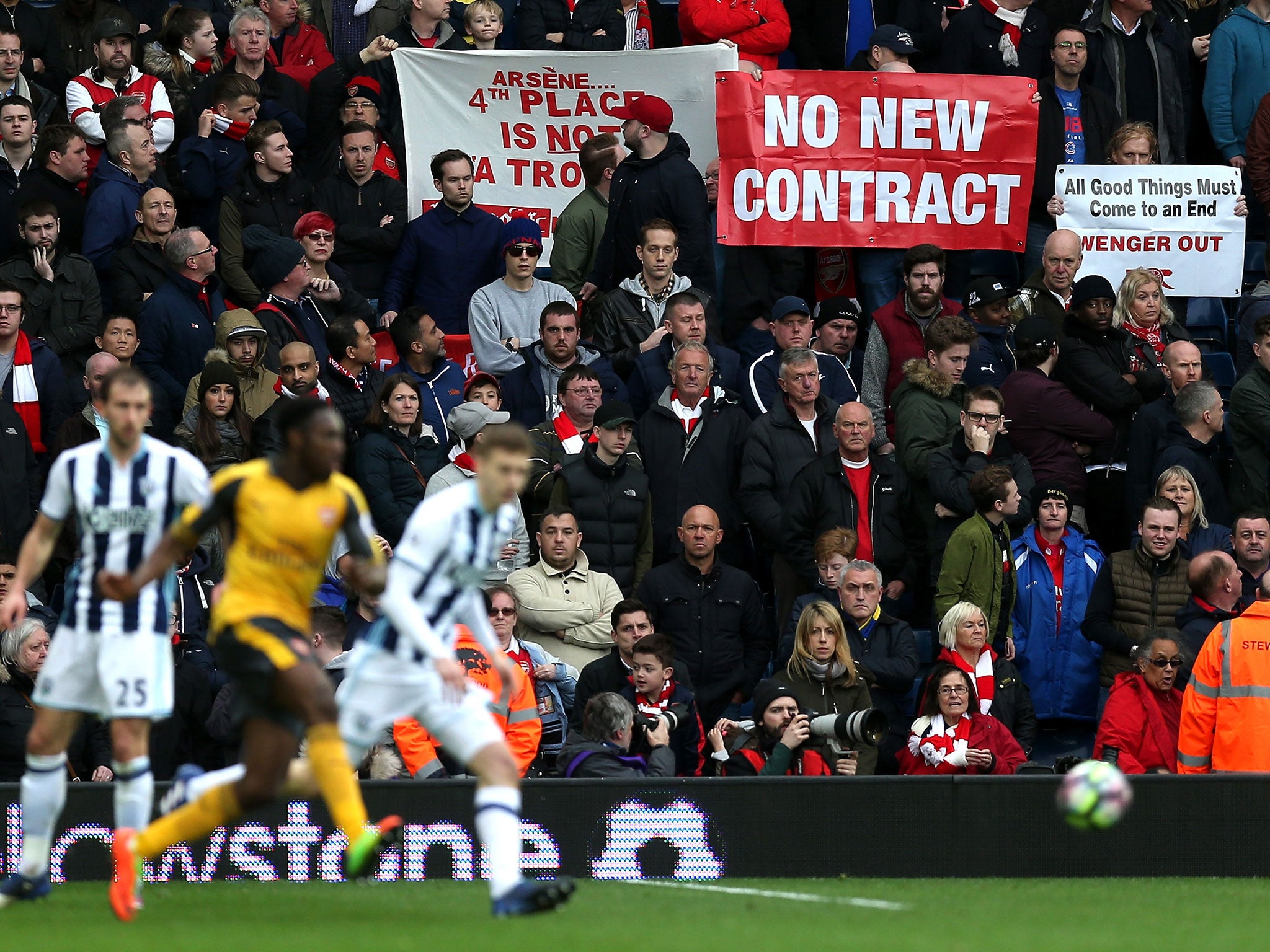 Arsenal fans protest against Wenger during their side's recent defeat by West Brom