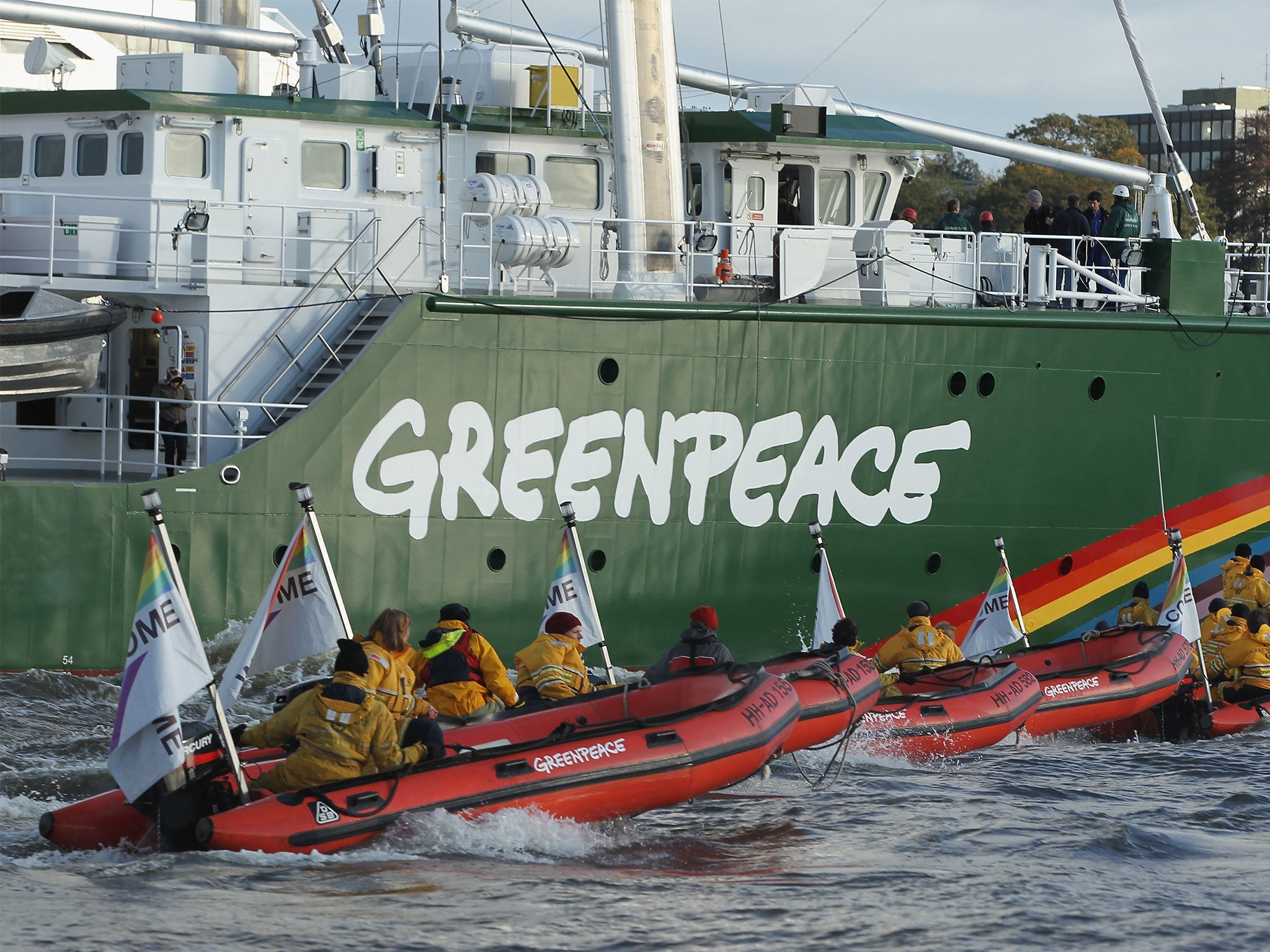 The Rainbow Warrior III, the newest ship of the enivornmental conservation organisation Greenpeace, accompanied by activists on its way to port in Hamburg
