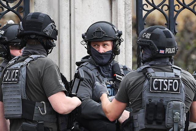 Armed police outside the Houses of Parliament