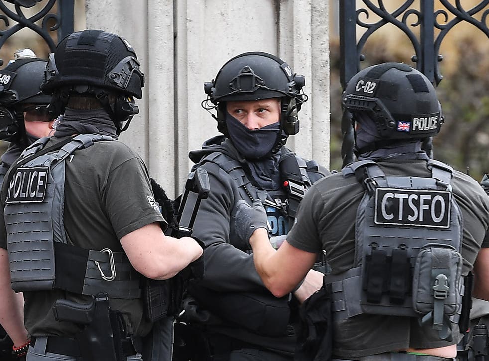 Armed police outside the Houses of Parliament
