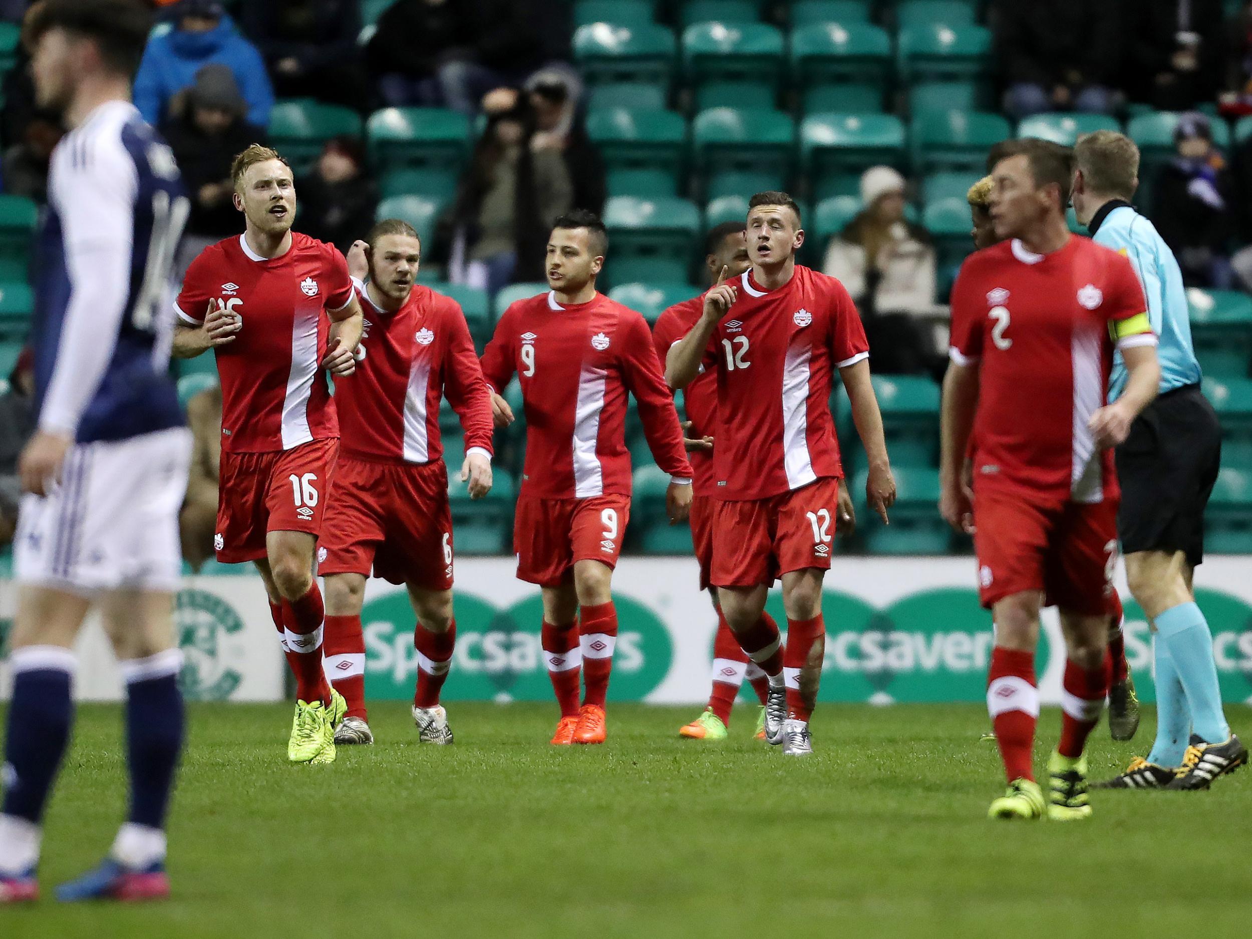 Canada's players celebrate their shock opening goal