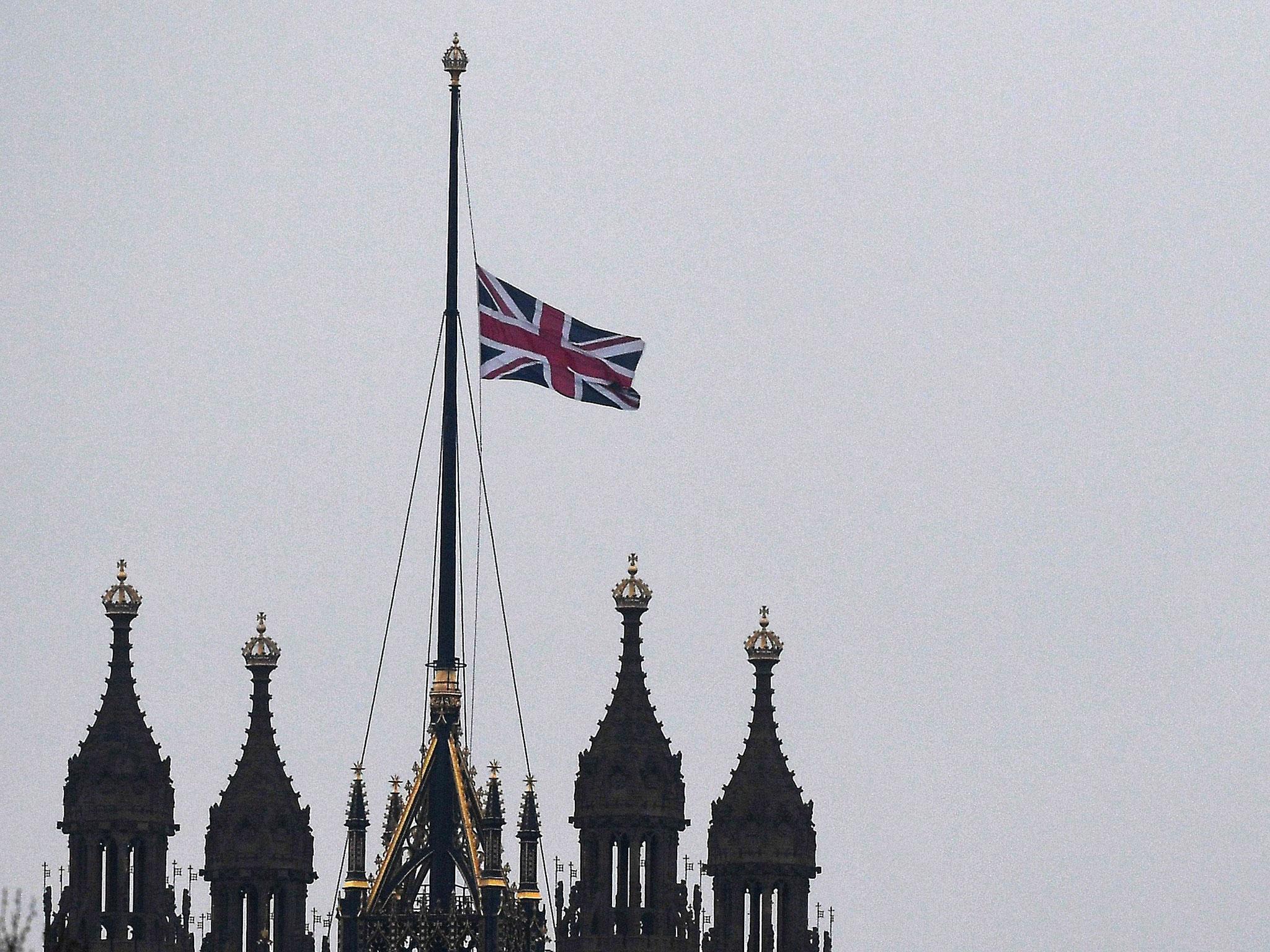 The Union flag flies at half mast at parliament after a suspected terror attack brought bloodshed to central London