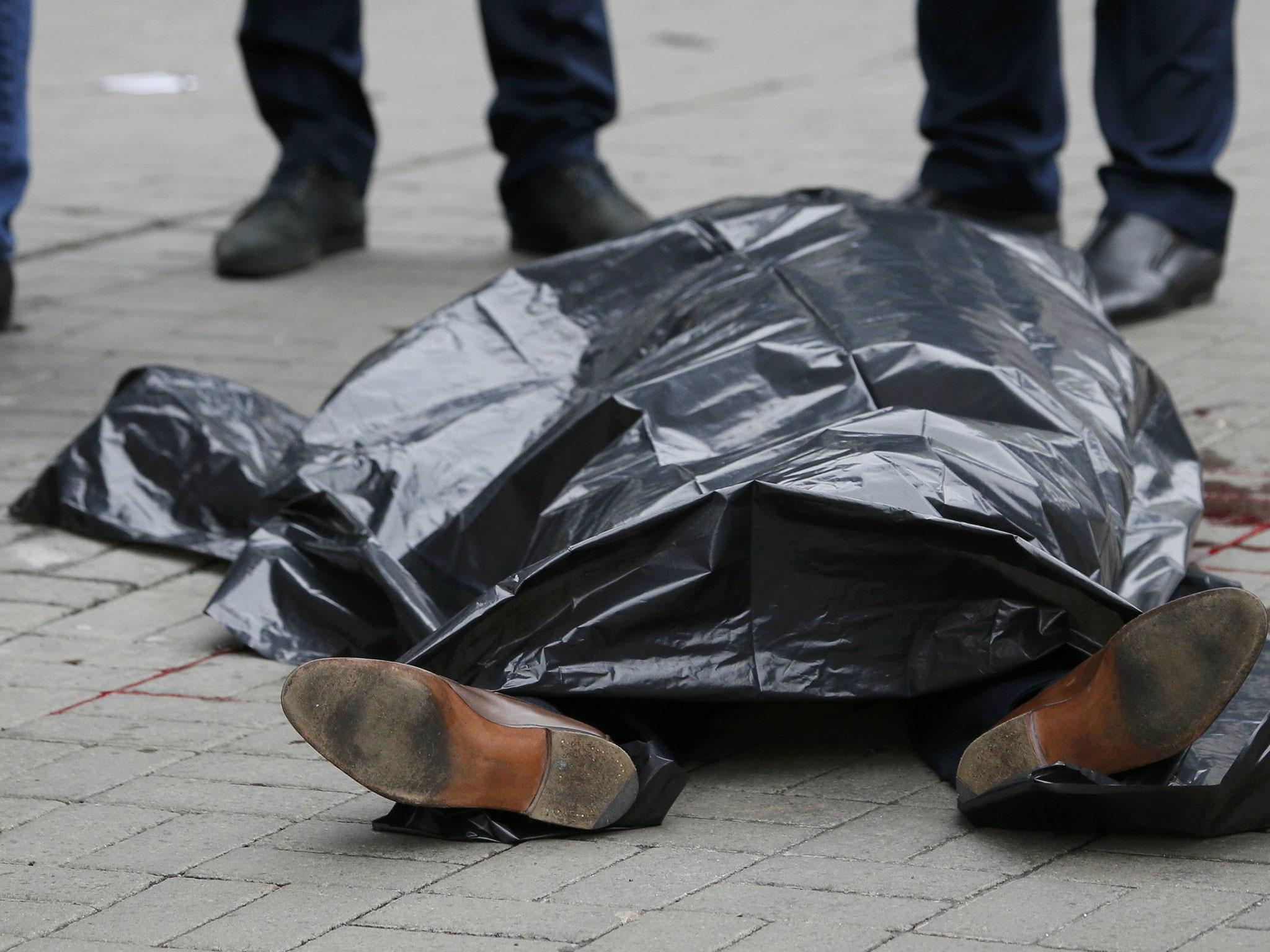 The covered body of Denis Voronenkov is seen outside a hotel in central Kiev