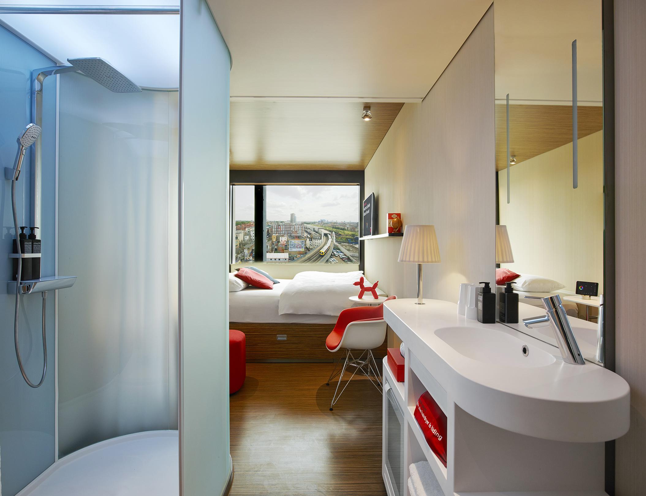 Mini-room, king-size bed: watch out for that bathroom if you’re sharing (citizenM)