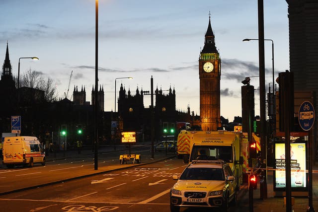 Emergency response workers continue to work over night following major incidents in Westminster Bridge in central London