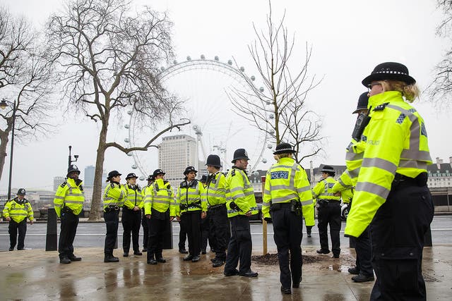 Police officers assemble on Victoria Embankment following yesterday's attack in London, England