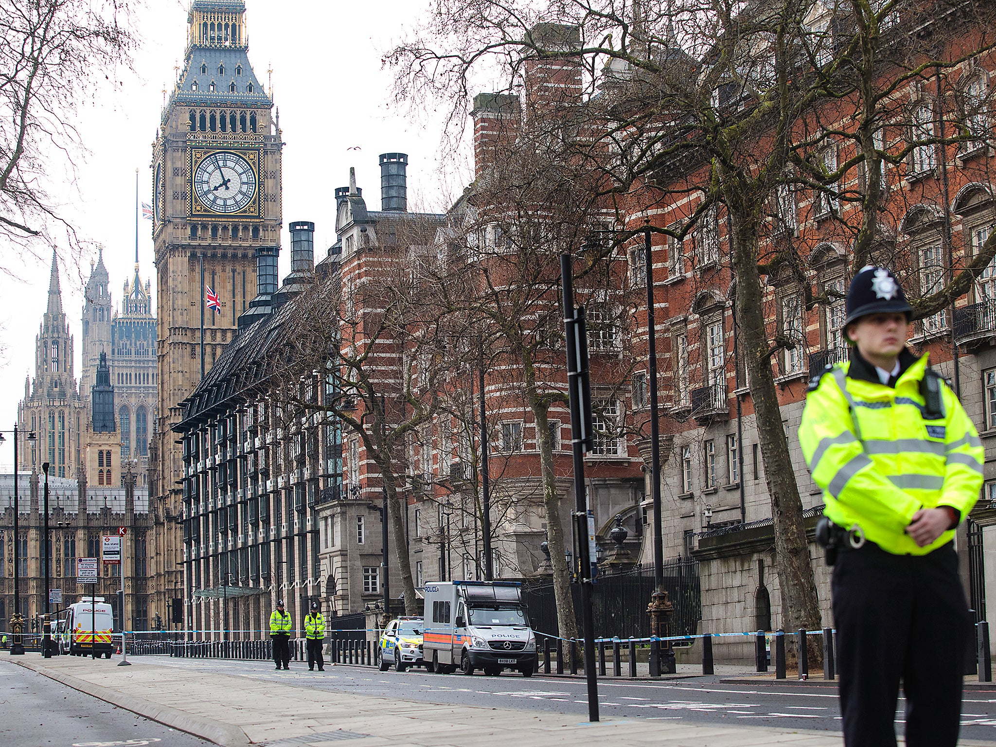 Police officers stand guard on Victoria Embankment following yesterday's attack  in London, England