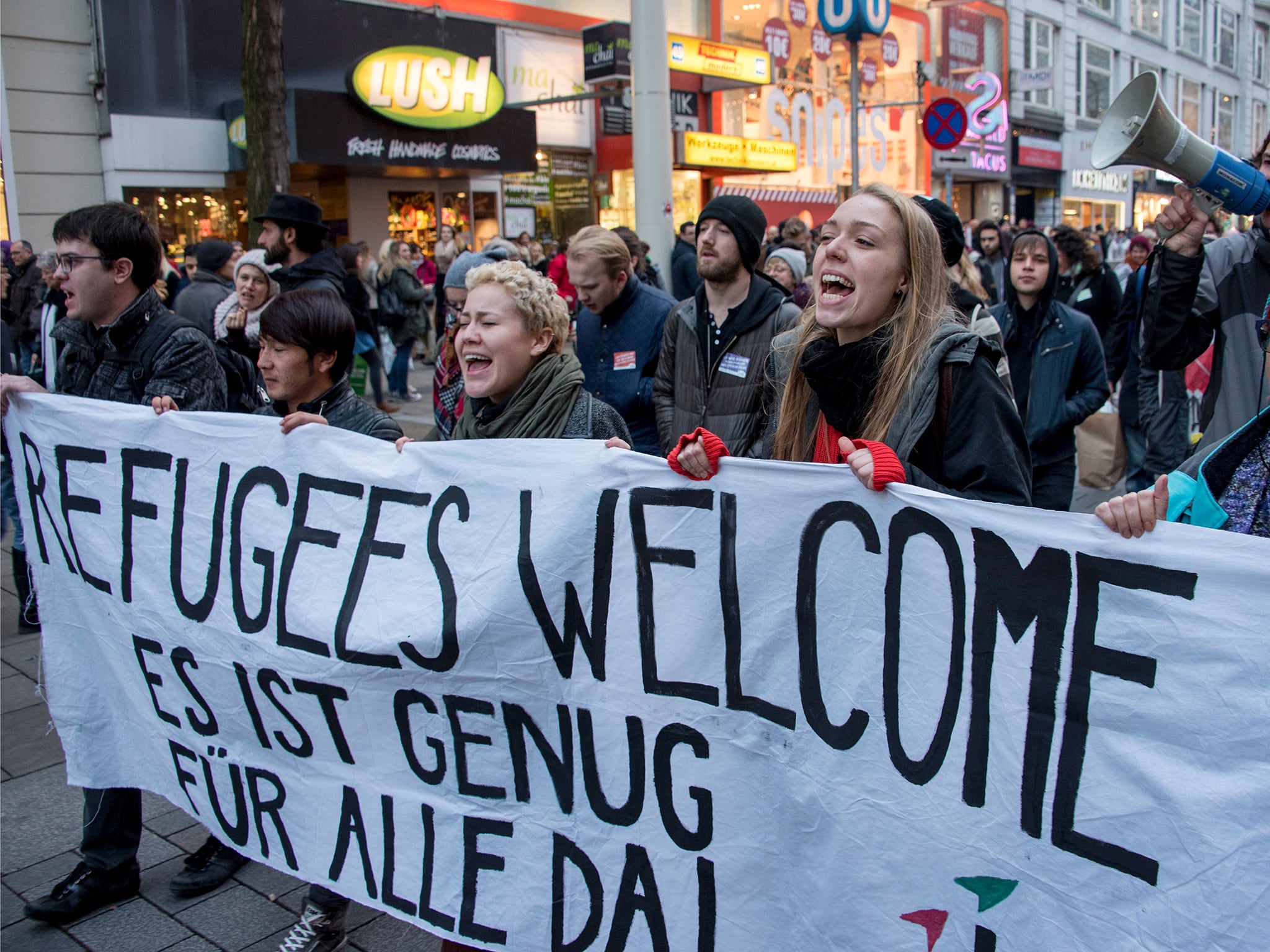 Austrian citizens and asylum seekers march during a pro-refugee protest called 'Let them stay' in Vienna, Austria, in November 2016.
