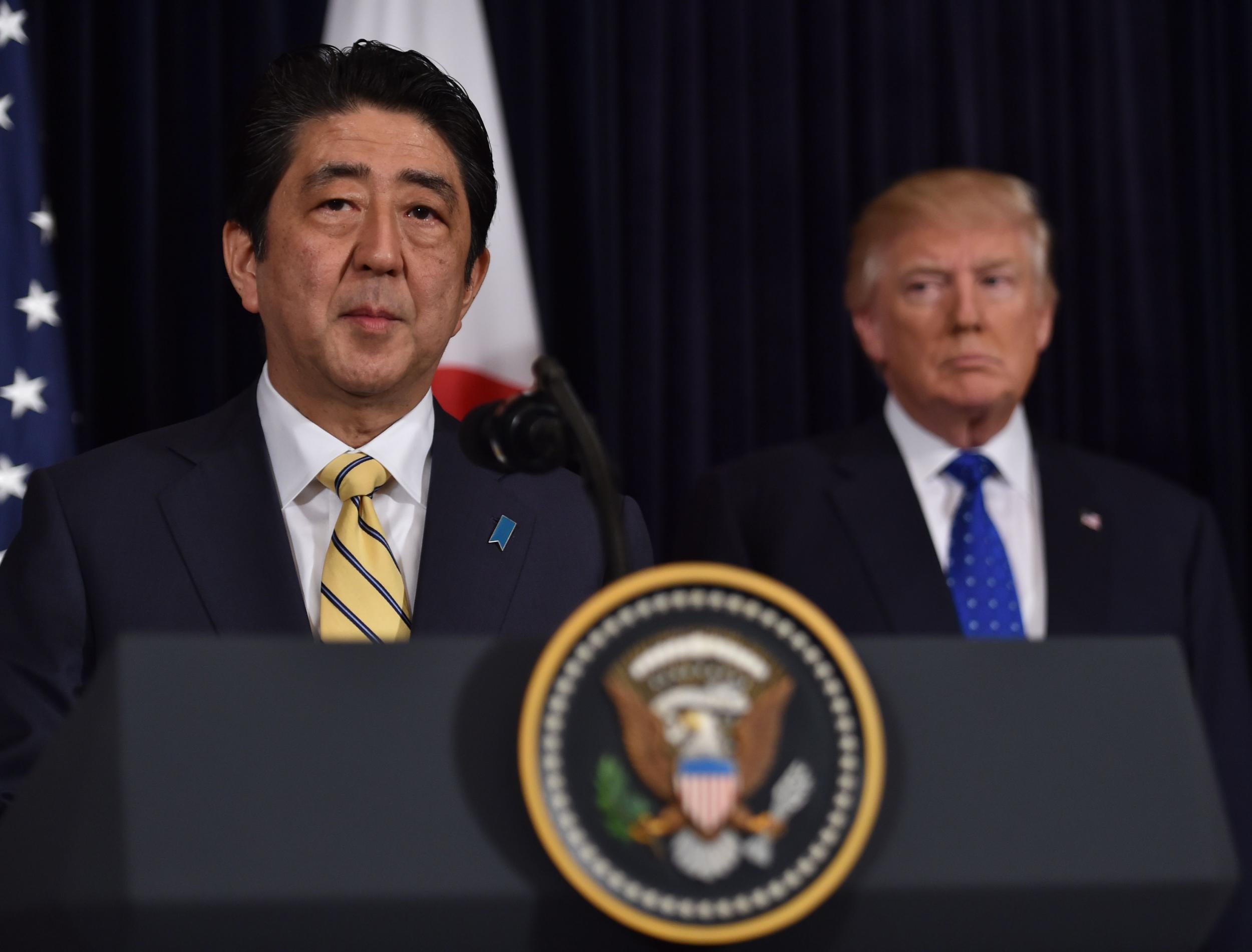 Japanese Prime Minister Shinzo Abe (L) and US President Donald Trump speak at Trump's Mar-a-Lago resort in Palm Beach, Florida, on February 11, 2017