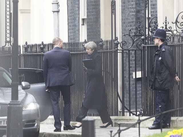 Prime Minister Theresa May leaves 10 Downing Street the morning after an attack by a man driving a car and wielding a knife left five people dead and dozens injured