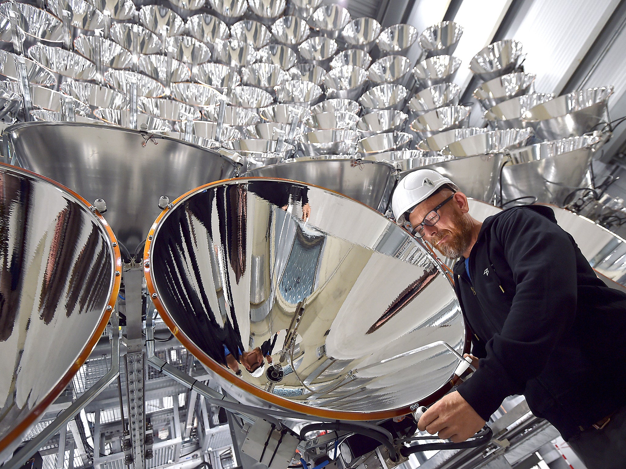 Photo engineer Volkmar Dohmen stands in front of xenon short-arc lamps in the DLR German national aeronautics and space research center in Juelich, western Germany