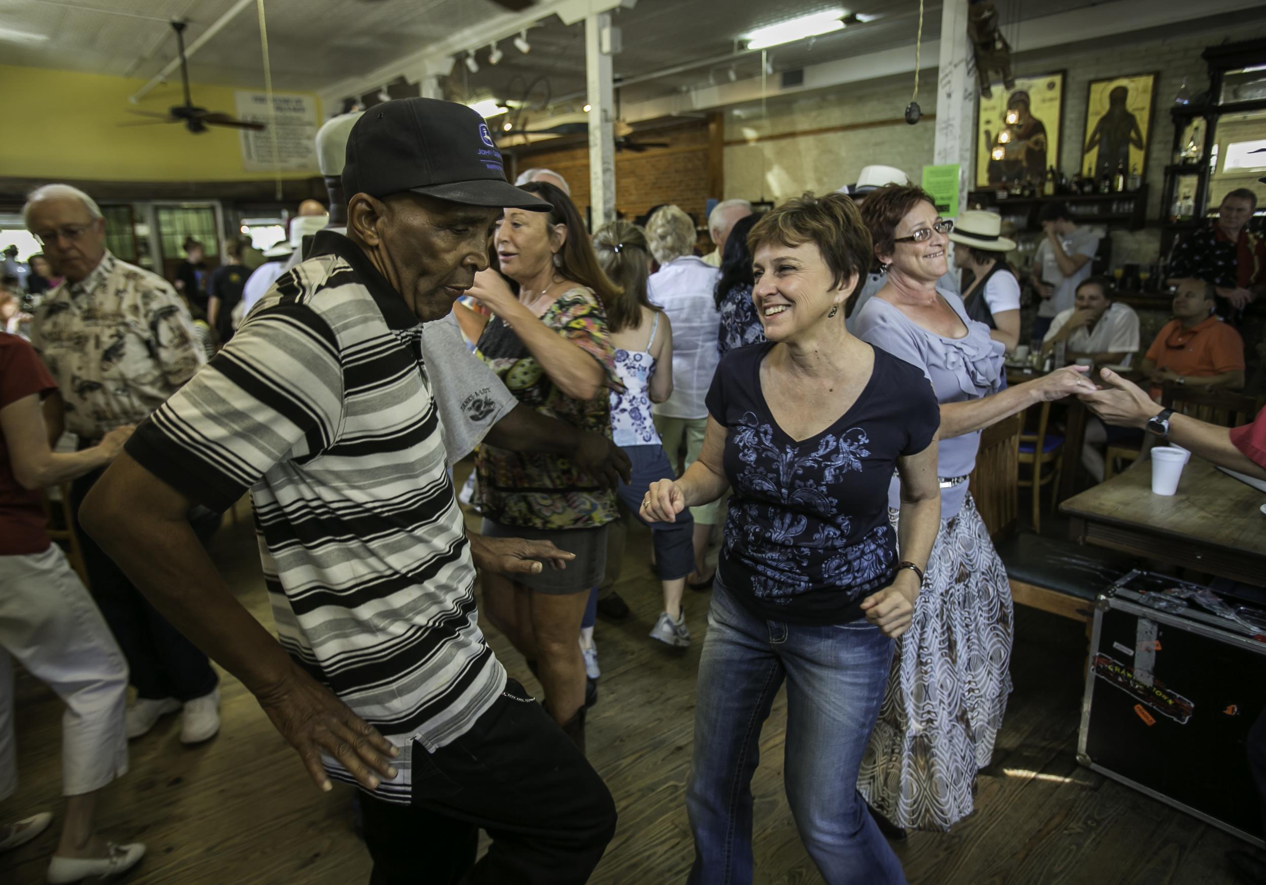 The weekend starts early in Cajun Country, with dancing from 8am at the Cafe des Amis