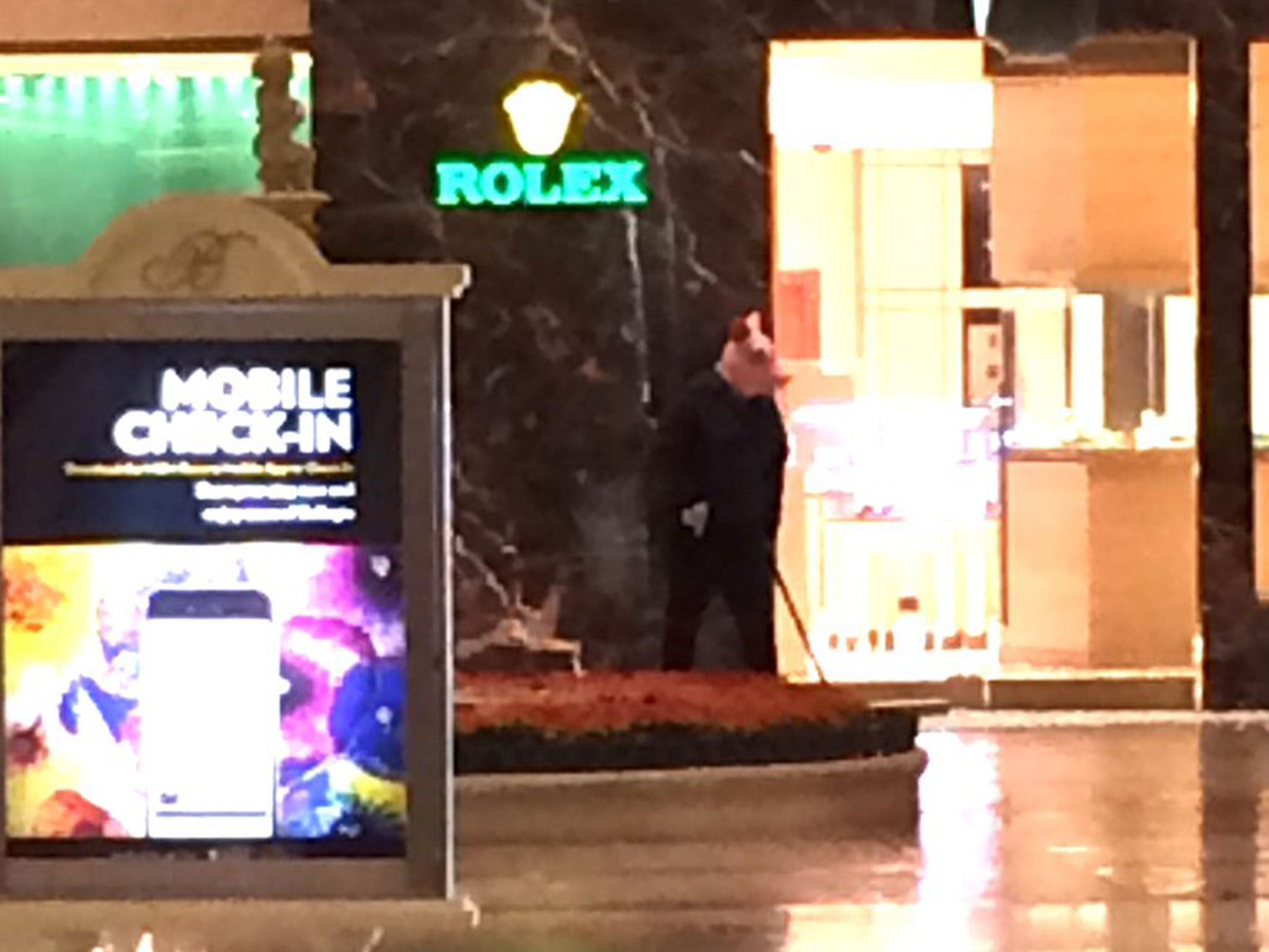 An armed robber in a pig mask at the Bellagio hotel and casino in Las Vegas on 25 March