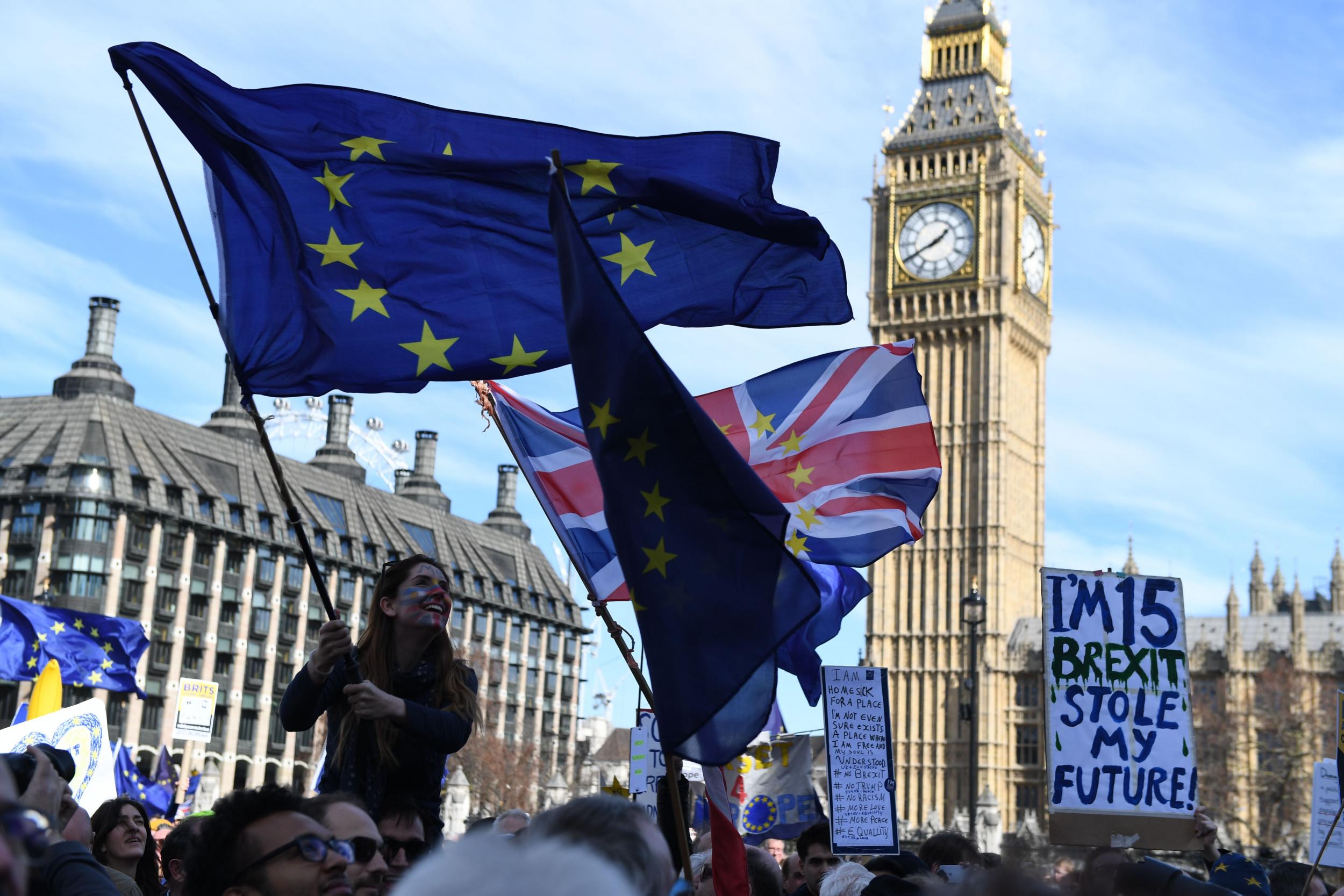 Demonstrators wave EU flags and Union Flags in Parliament Square