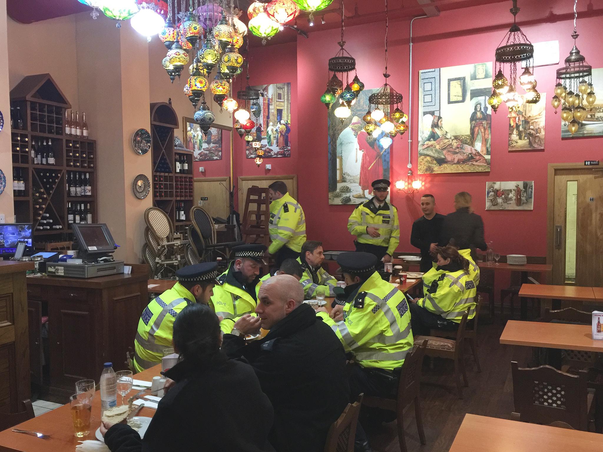 Emergency workers eat at Ibrahim Dogus' Troia restaurant