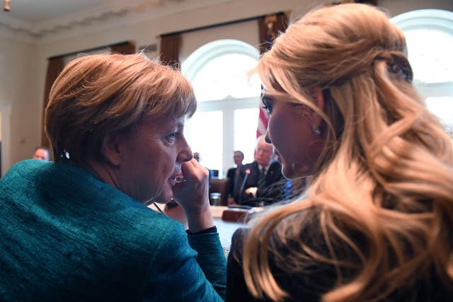 German Chancellor Angela Merkel (L) speaks with Ivanka Trump during a roundtable discussion on vocational training with United States and German business leaders in the Cabinet Room of the White House on March 17, 2017 in Washington, DC