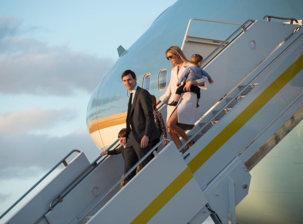 Ivanka Trump, daughter of US President Donald Trump, her husband Jared Kushner, senior adviser to Trump, and their children walk off Air Force One at Palm Beach International Airport in Florida