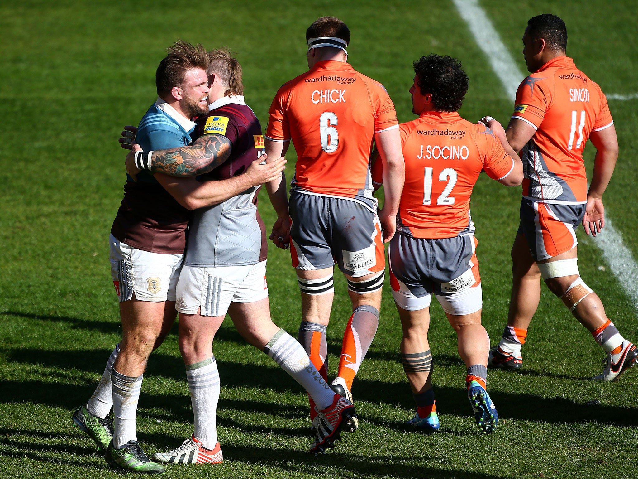 Joe Marler embraces Rob Buchanon after the latter's try