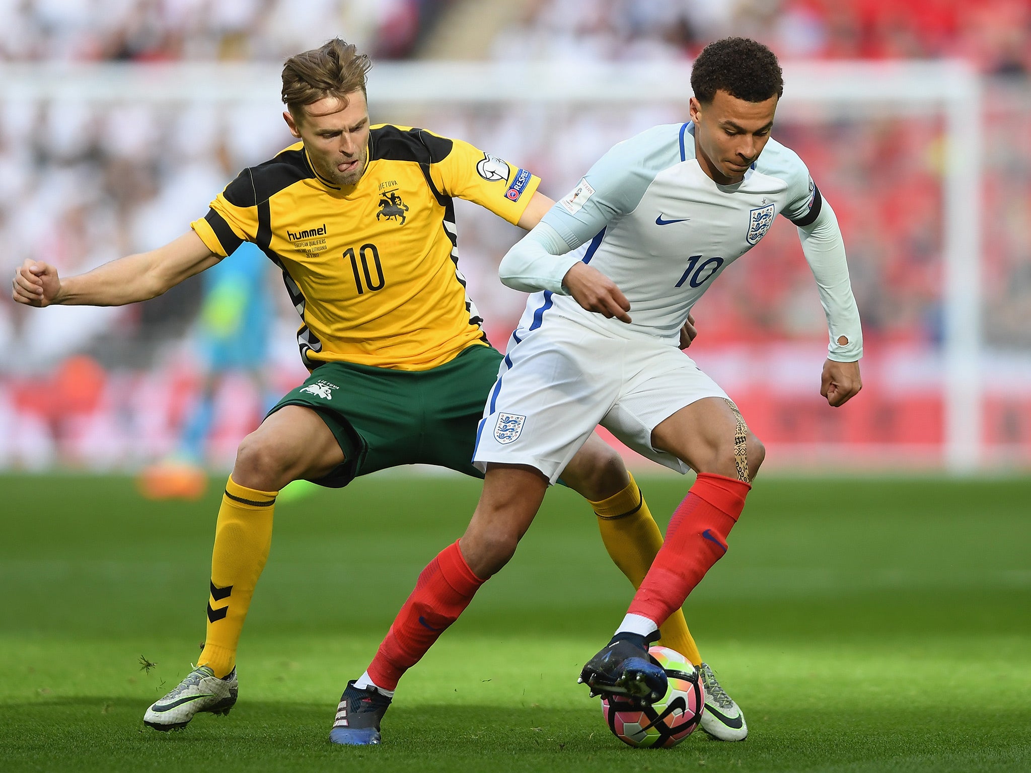 Dele Alli dribbles with the ball in the opening stages at Wembley