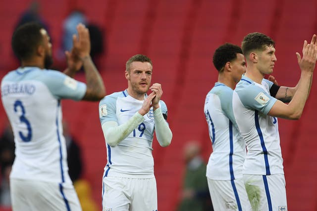 England's players applaud after the final whistle