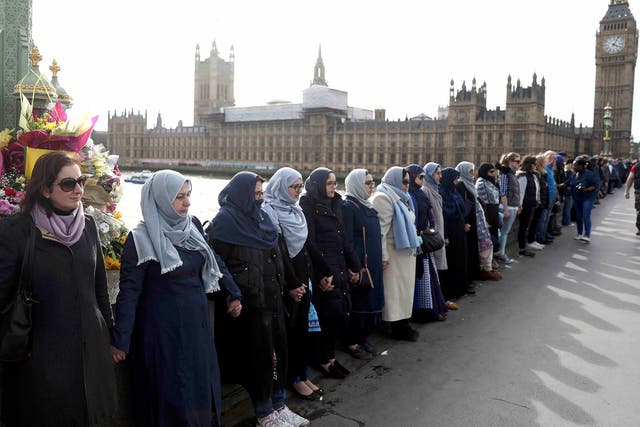 The women held hands in silence to remember victims of the terror attack in Westminster