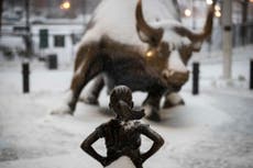 Bank behind Fearless Girl statue to pay $5m over gender pay gap claims