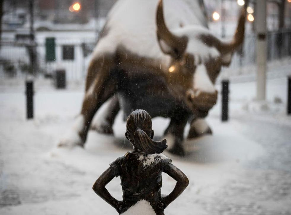 The Fearless Girl statue faces down the Charging Bull