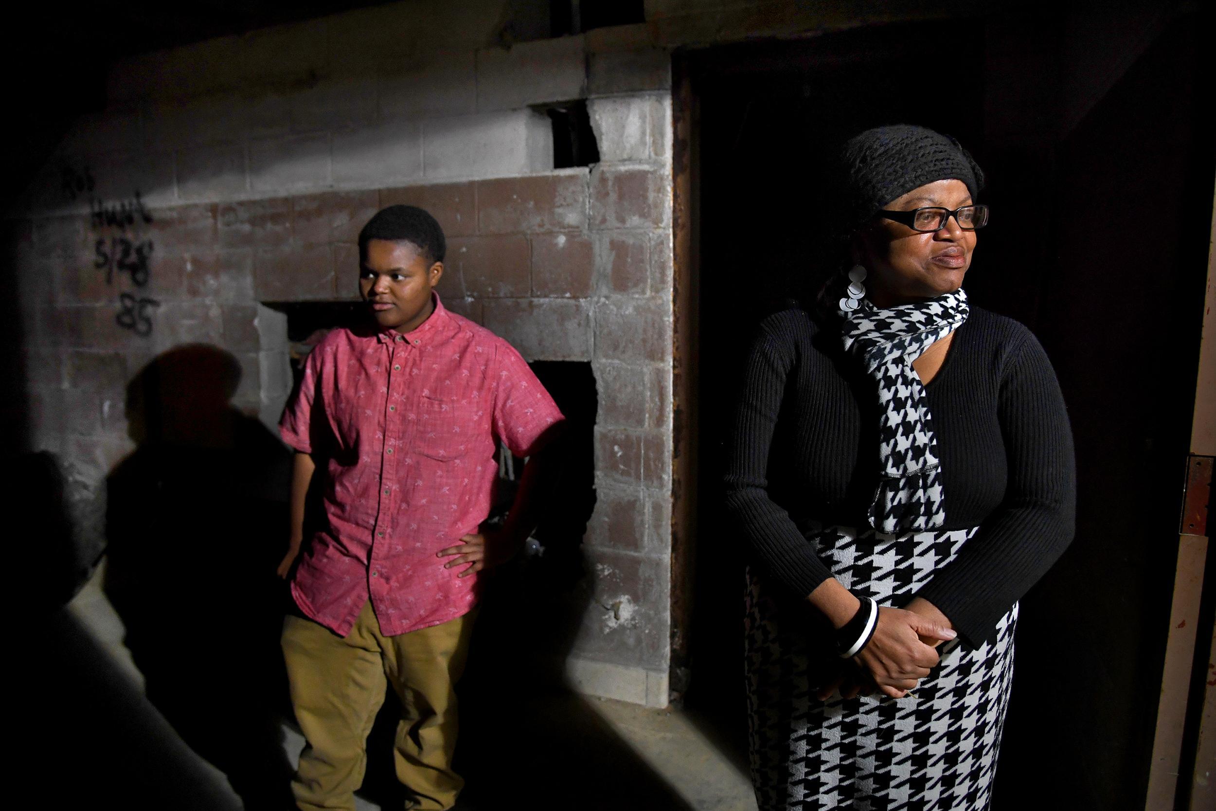 Valerie Scott with her daughter Jazz, tours the unfinished basement at the Dubois Community Centre (Washington Post/Michael S Williamson)