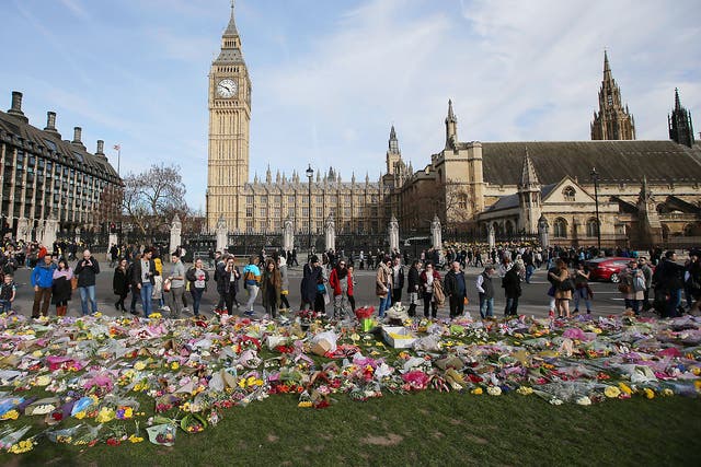 Floral tributes to the victims of the Westminster terror attack are seen in Parliament Square in central London