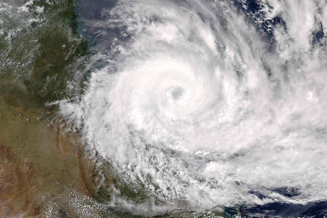 Photo shows a natural colour image captured by the Moderate Resolution Imaging Spectroradiometer on NASA's Aqua satellite of Cyclone Debbie approaching the coast of Queensland