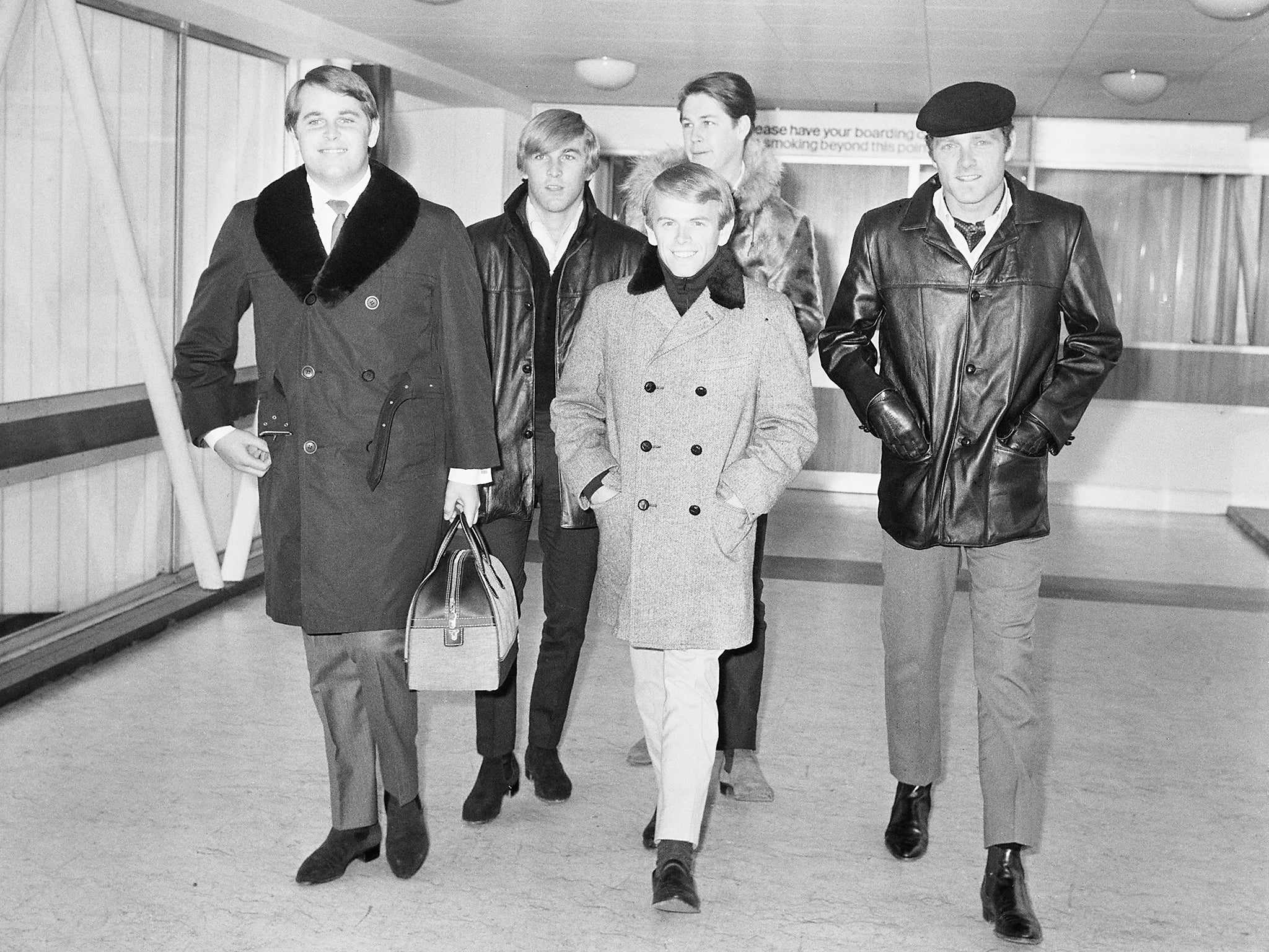 &#13;
The band arriving in London in November 1964 (Getty)&#13;